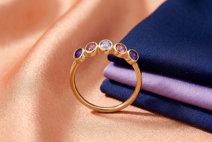 Violet Halo ring concept styled with peach fabric and navy and lavender clothing