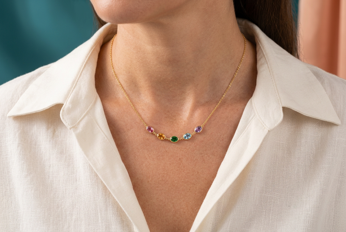 Five-color necklace worn with ivory open-collar shirt