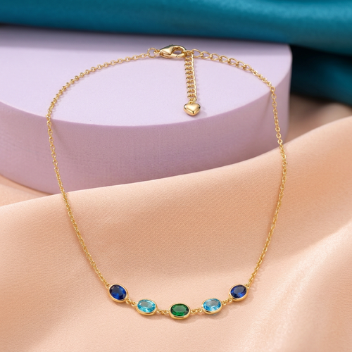 Sea Glass blue aqua green necklace on peach silk with lilac pedestal and teal backdrop