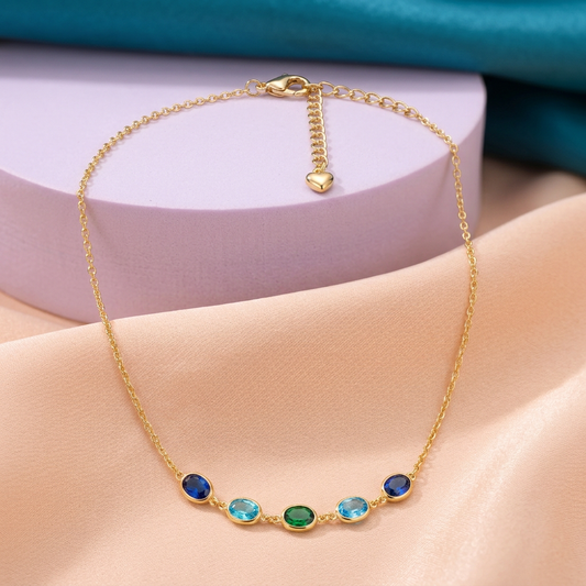 Sea Glass blue aqua green necklace on peach silk with lilac pedestal and teal backdrop