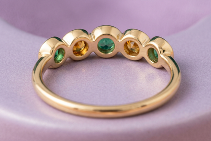 Emerald Dawn closed gold-tone band and bezel underside concept detail
