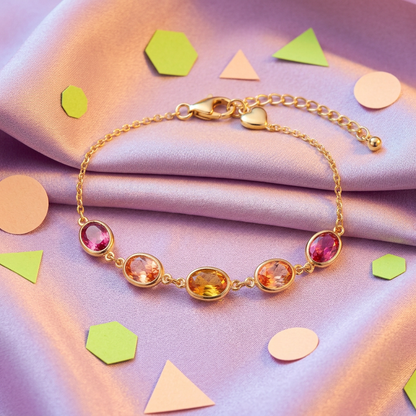 Pink peach amber bracelet on lilac silk with colorful geometric props