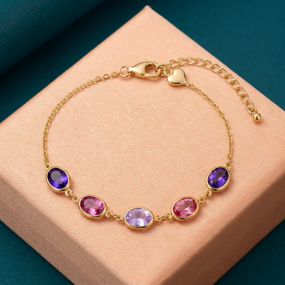 Lilac Reverie violet pink lavender oval bracelet on peach surface with teal background