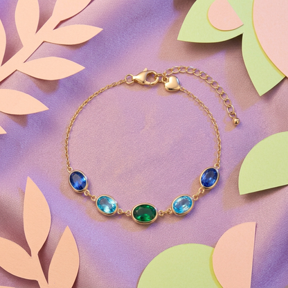 Five blue aqua green oval accents on lilac silk with peach and lime paper shapes