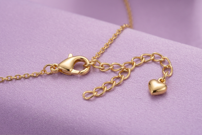 Close-up of lobster-style necklace clasp and extension with heart end detail