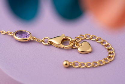 Close-up of lobster-style clasp extension chain and heart charm