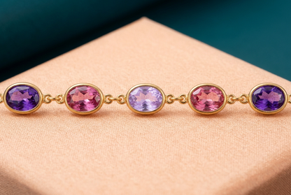 Macro of violet pink pale lavender pink violet oval accents with gold-tone rims