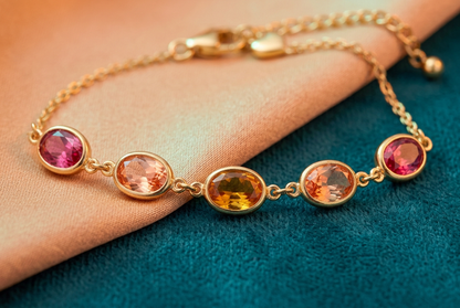 Macro of five oval accents in pink peach amber peach pink sequence